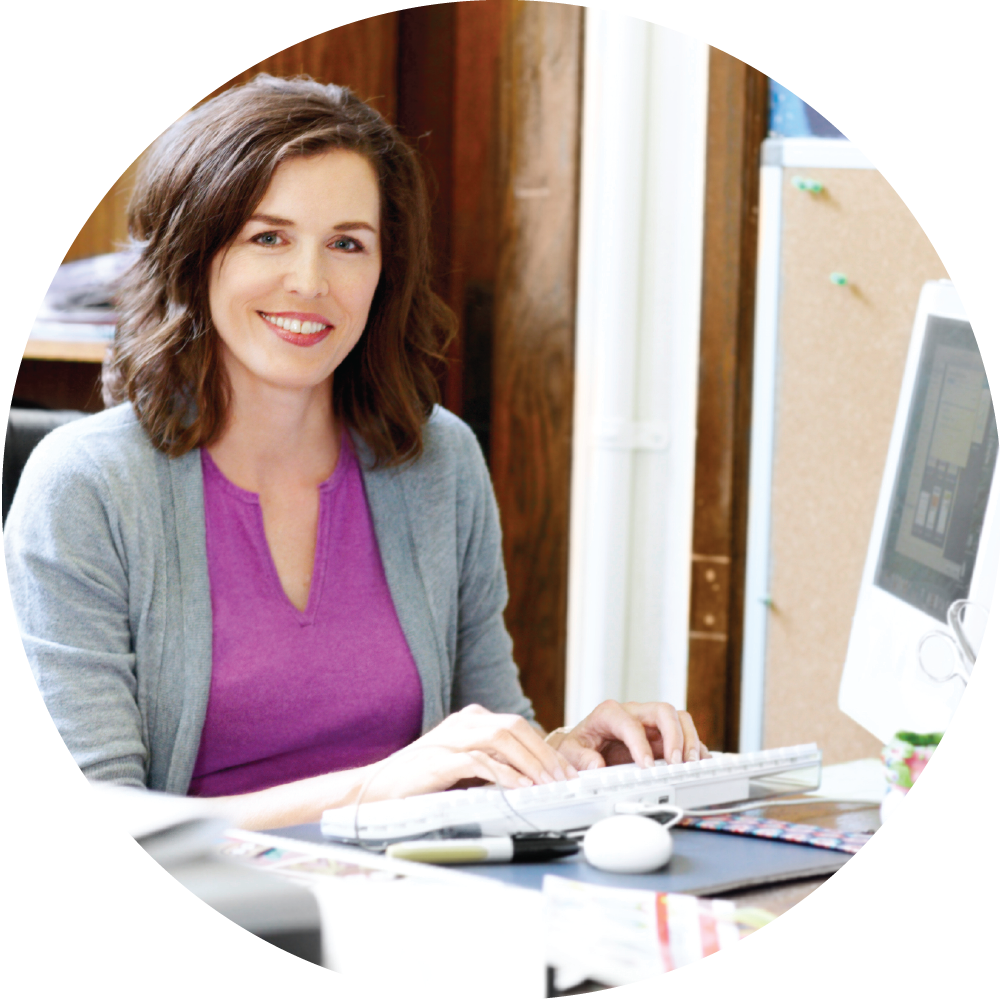 Happy teacher holding tablet